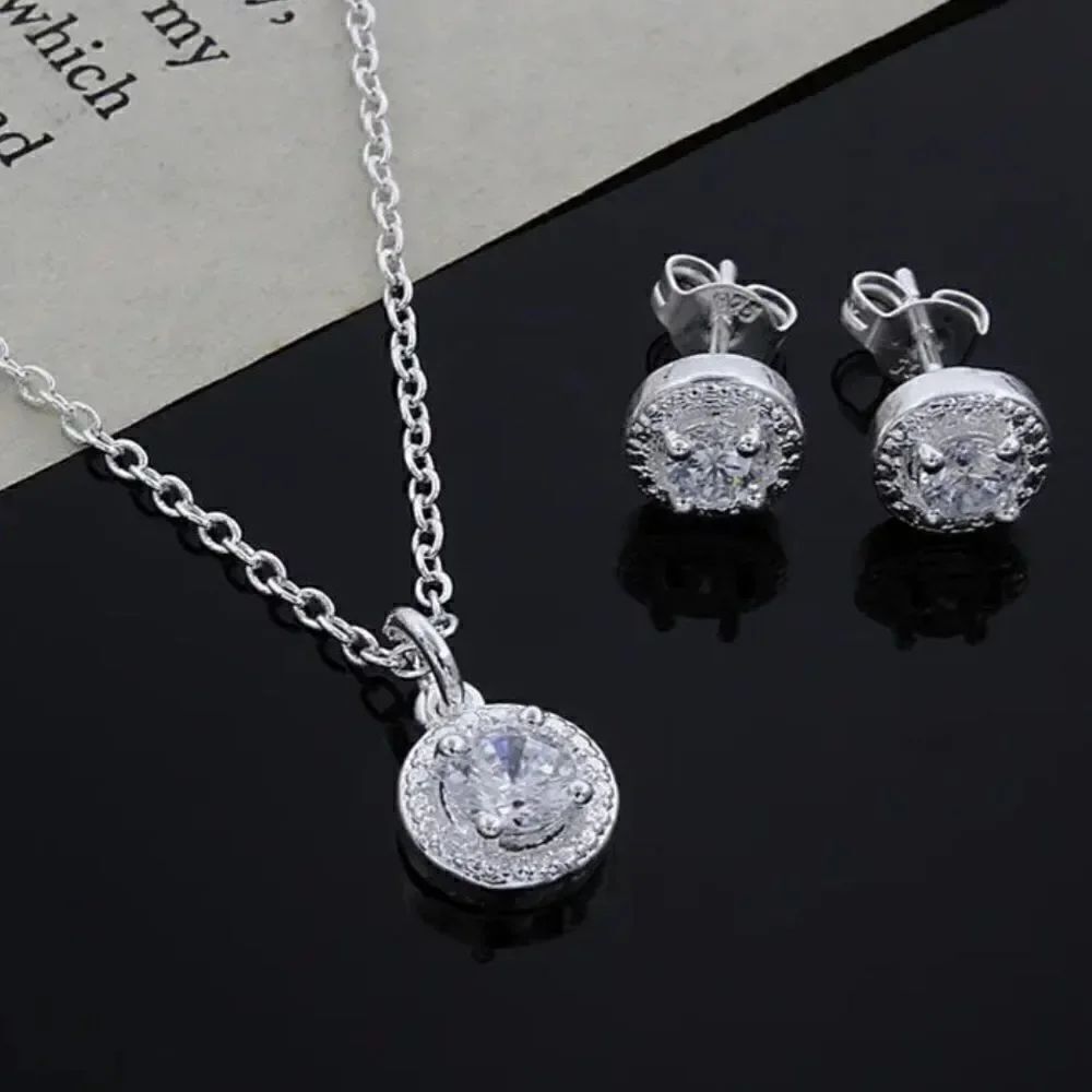 The Dainty Solitaire pendant necklace and stud earrings set in sterling silver